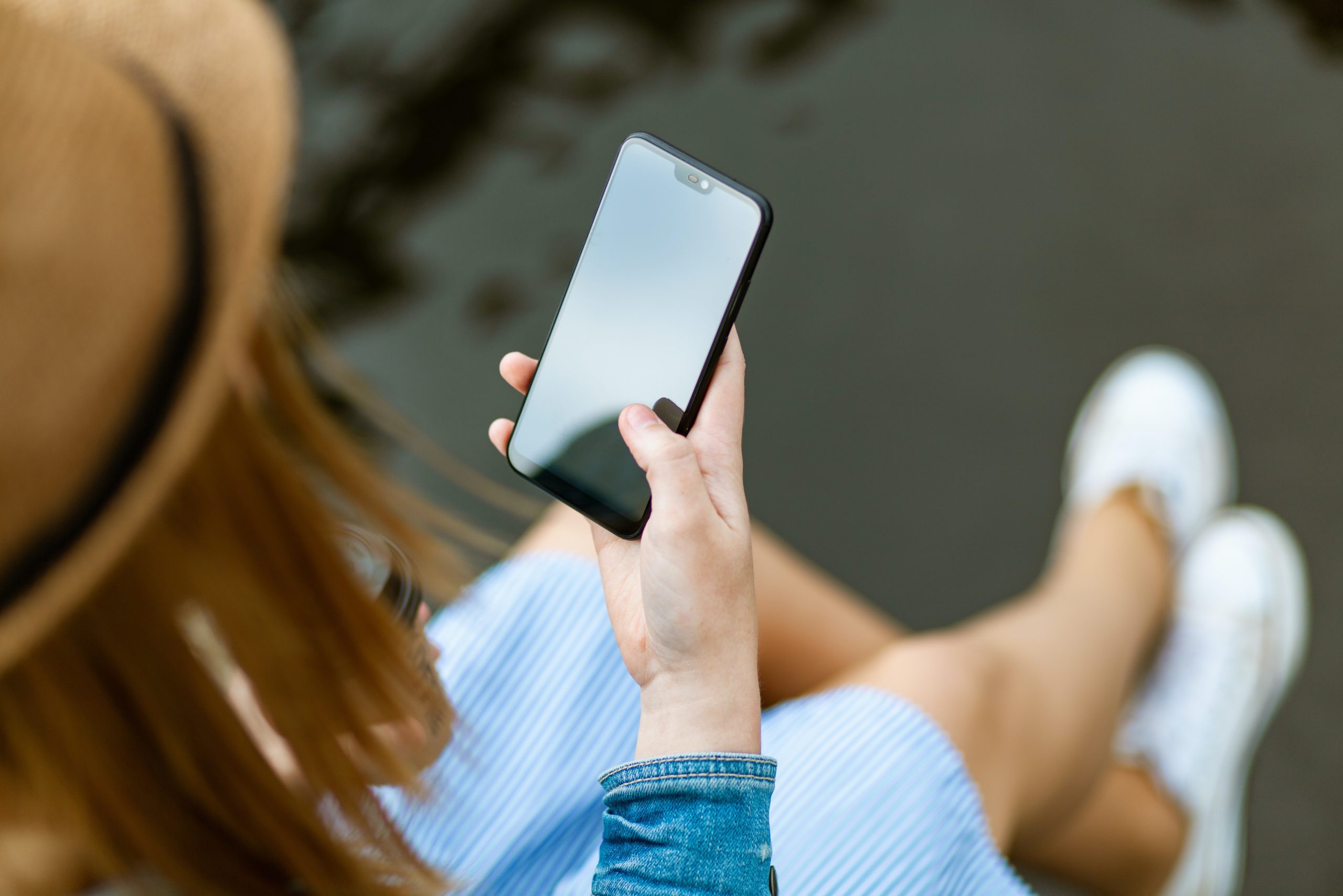 How SMS Marketing Continues To Be Relevant In 2020 - Hand Holding Cellphone